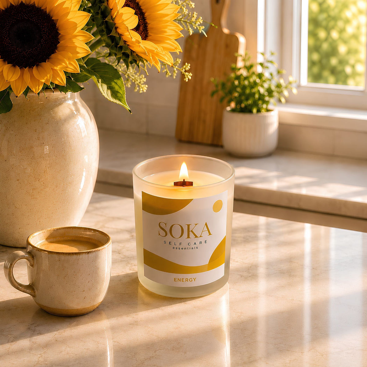 Soka candle with a cup of coffee and sunflowers on a marble surface